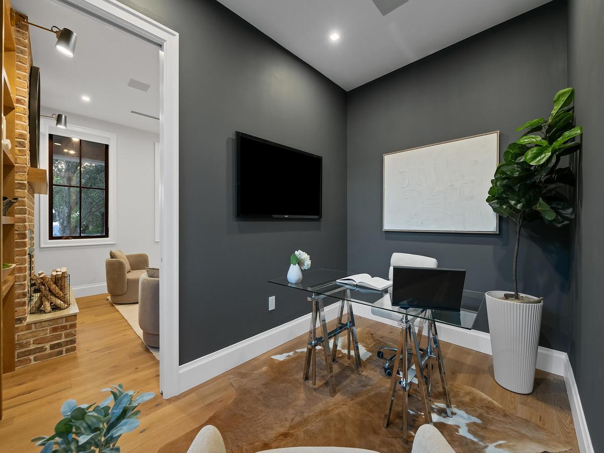 Private office with dark accent wall