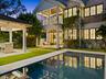 Rear exterior with pool at dusk