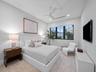 Bright guest bedroom with seating