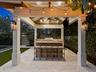Outdoor bar and kitchen under the pergola