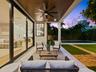 Covered patio with pool beyond