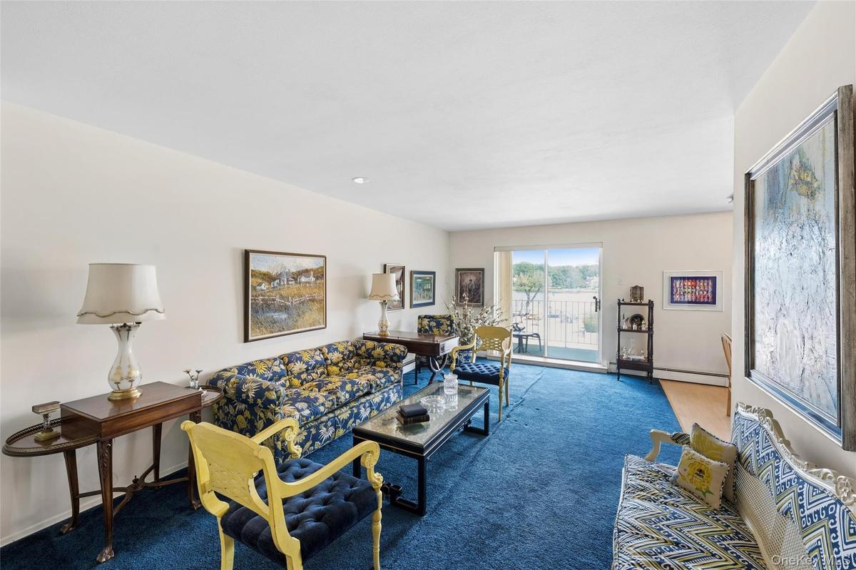 Oversized Living Room with Sliders to Balcony