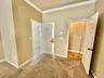 Master bedroom with 2 walk in closets