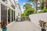 Backyard wraps all the way around to the pool