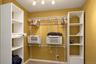 Adjustable shelving system unit and motion sensor lighting
