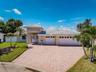 Pretty paver drive highlights this beautiful home