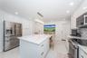 Beautiful quartz island with deep soft close drawers and charging outlets