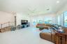 Five big picture windows allow you to enjoy the water view. 3 small steps lead to primary bedroom.