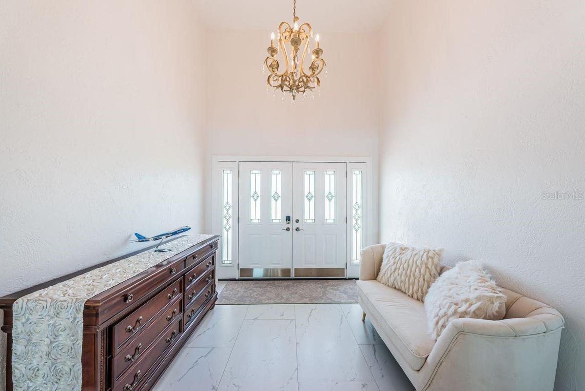 Foyer entry with vaulted ceiling
