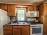 Upper Apartment  Galley Kitchen with wood cabinets