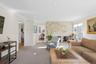 Living area featuring ornamental molding, a fireplace, carpet floors, and recessed lighting