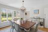 Dining room featuring light wood-style flooring and a chandelier