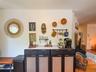 Upper Apartment  Galley Kitchen with Hardwood-style flooring
