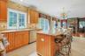 Porcelanonsa, Imported Travertine Crema-Marfil Natural Stone Throughout Kitchen