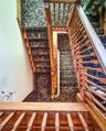 Wood staircases with ornate balusters