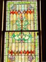 Stained glass window featuring an ornate, multi-color design