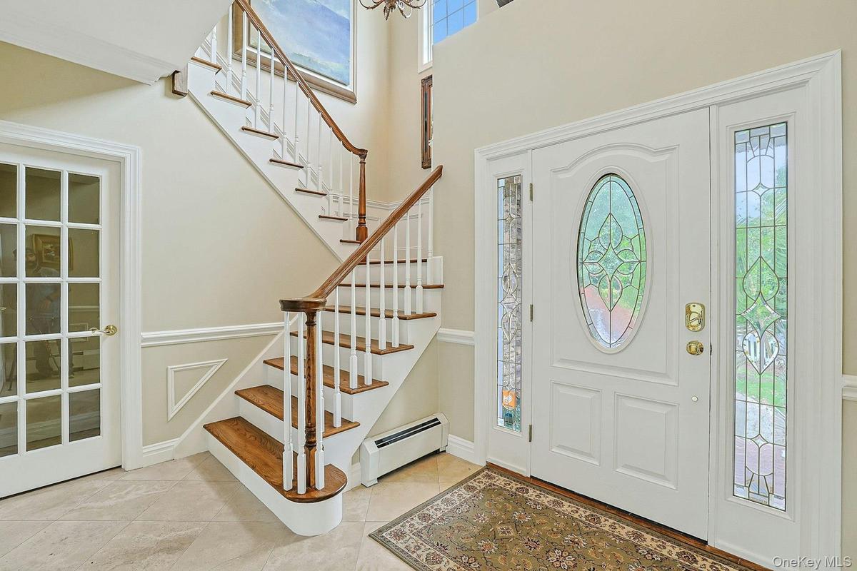 Elegant Two-Story  Entry W/Porcelanonsa, Imported Travertine Crema-Marfil Natural Stone Throughout