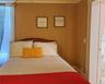 Main House Upstairs Bedroom Hardwood flooring, painted walls with decorative border, white trim
