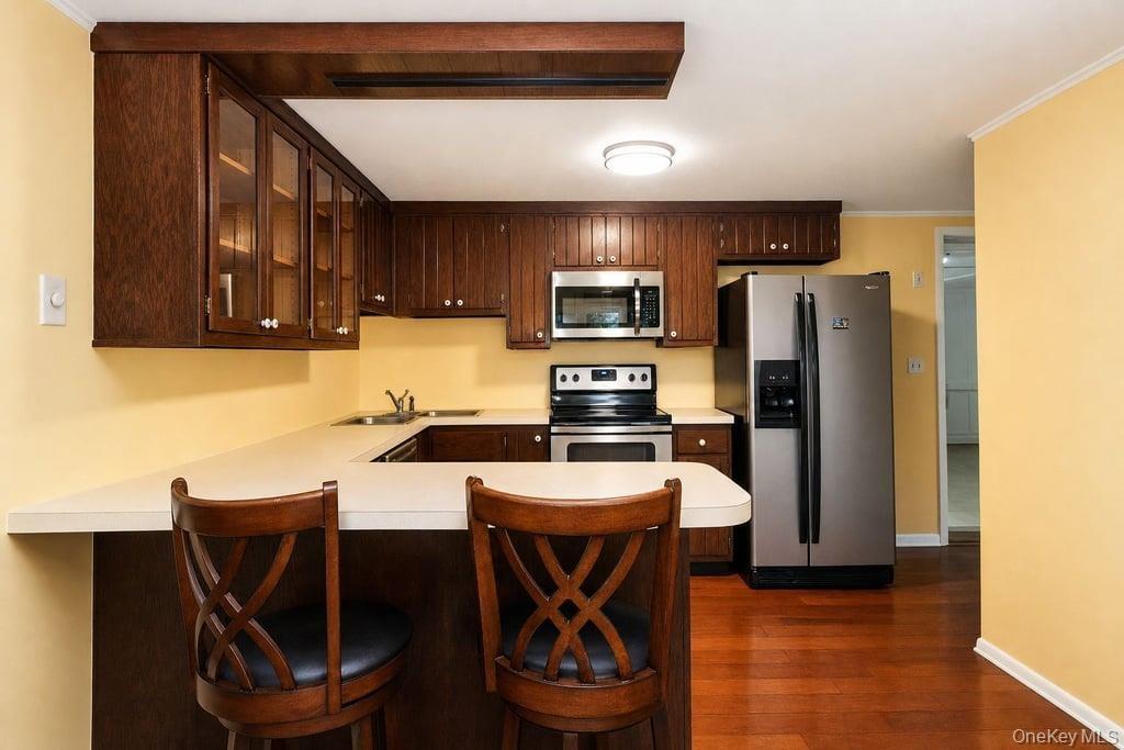 Solid wood custom cabinets and stainless steel appliances