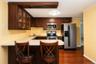 Solid wood custom cabinets and stainless steel appliances