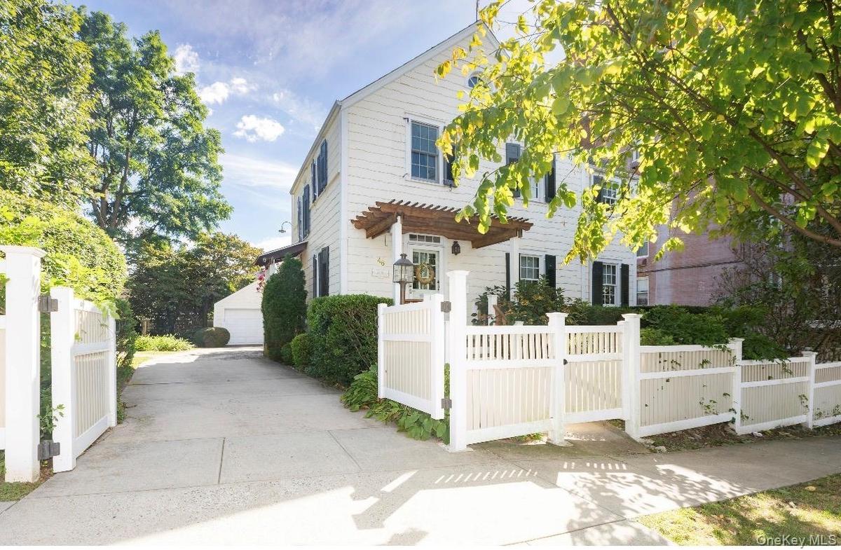 Nicely manicured driveway leading to garage