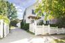Nicely manicured driveway leading to garage