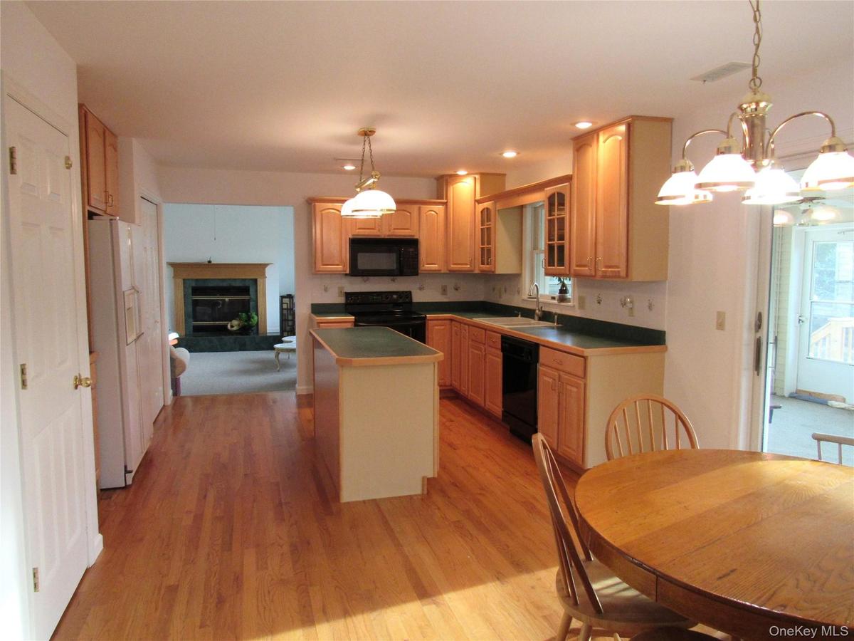 Kitchen leading to Sunroom