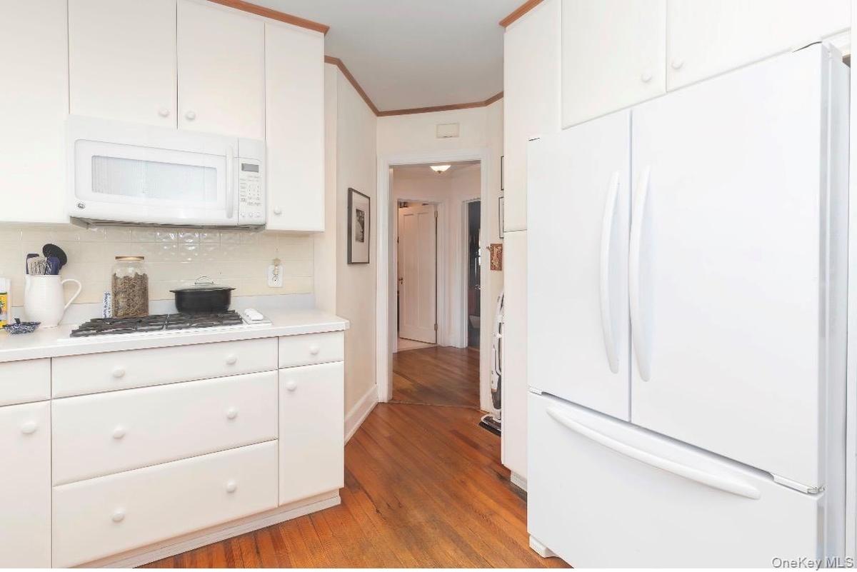 Hallway leading from kitchen to eat in kitchen area