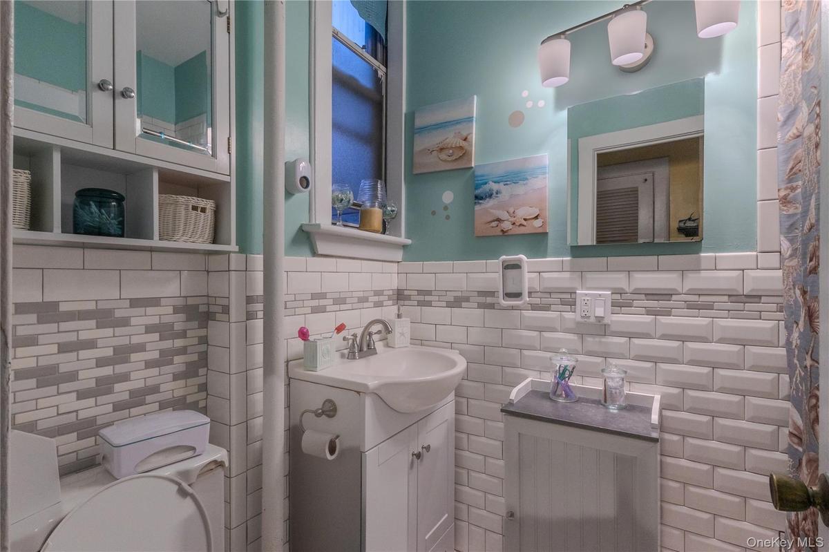 White subway tile with a decorative accent band