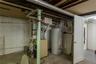 Utility room with water heater and boiler.