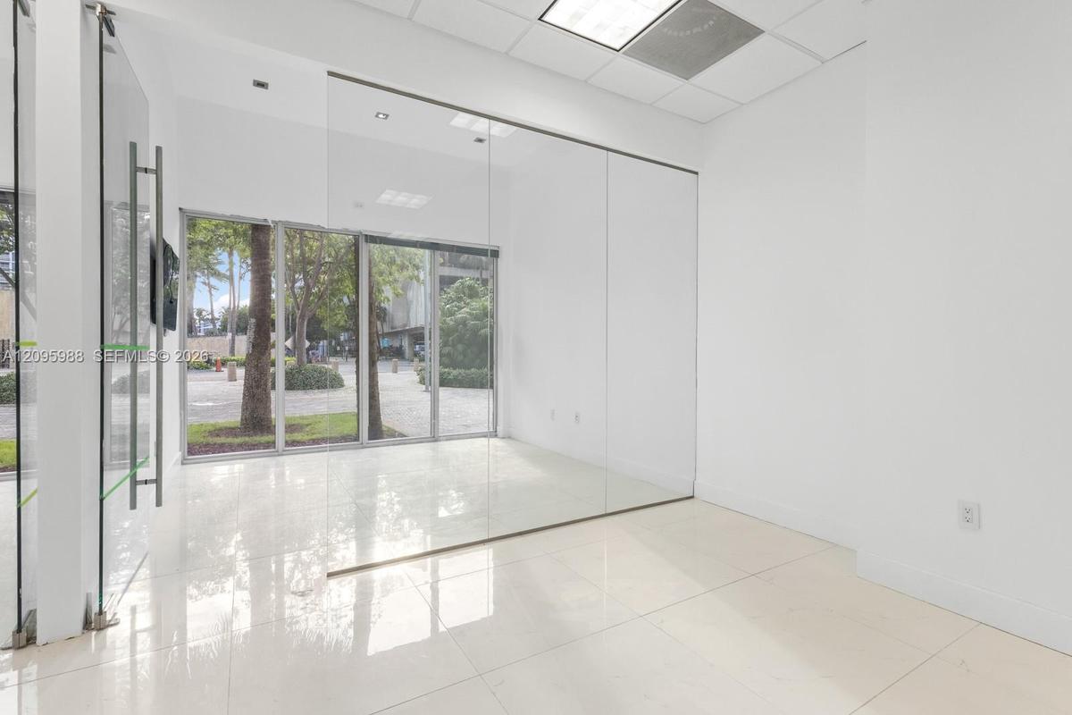 Glass-walled front room with storefront windows