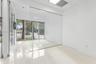 Glass-walled front room with storefront windows