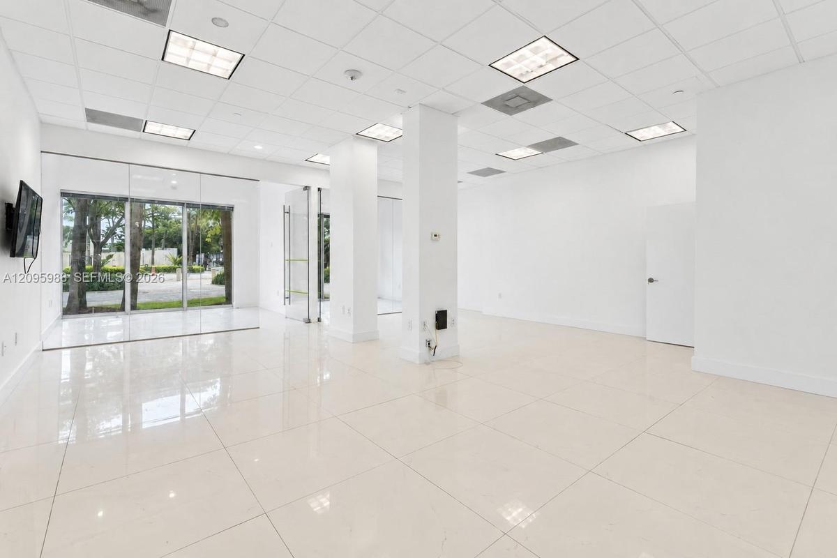 Open suite interior toward storefront glazing