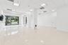 Open suite interior toward storefront glazing
