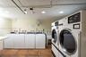 1 of 2 laundry rooms; commercial gas dryers