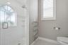 Luxurious shower and towel warmer.