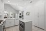 Breakfast bar with the dinette beyond creates a perfect space to congregate.