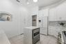 Discreet microwave in the kitchen island keeps the streamlined look of the kitchen.