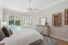 Primary bedroom has high ceilings accentuating the space.