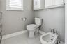 Separate commode, bidet and towel warmer for your shower experience.