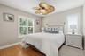 Guest bedroom with adjacent pool bathroom.