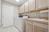 Interior laundry room with utility sink.