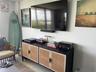 Wall-mounted media console with natural cane door panels