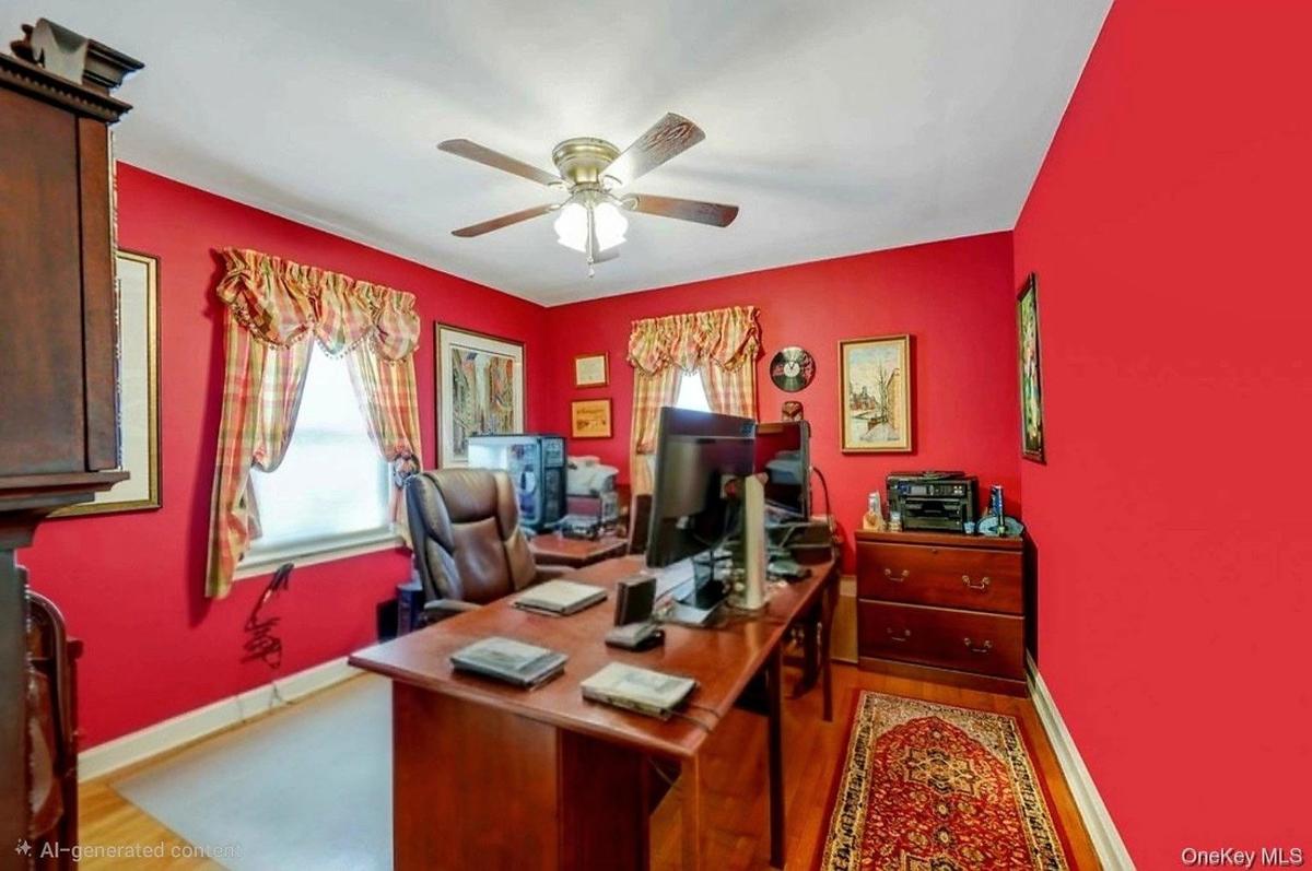 Hardwood-style flooring, ceiling fan with integrated lighting, and multiple windows