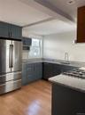 Beautifully done kitchen with a separate large pantry. In unit laundry also on this floor along with large bedroom and full bath.