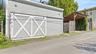 Off street parking with oversized garage with EV charger and a separate carport.