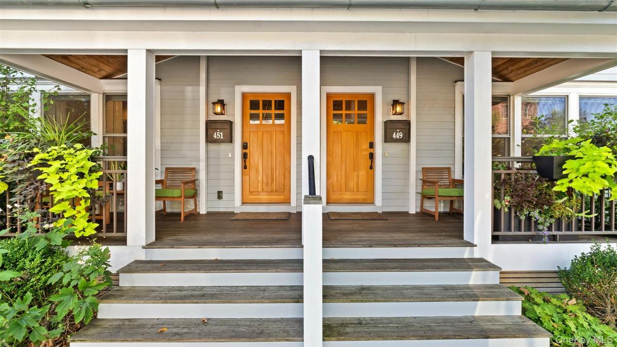 Primary residence on right side on three floors. Two bedroom two full bath apt on second and third floor, entrance on left.