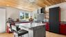 Large island with seating and a separate breakfast bar.