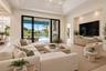 Virtually Staged Living Room/Great Room that looks out to the pool and lake.