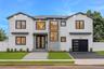Contemporary exterior featuring white vertical siding, black-framed windows, a two-car garage with a modern door, a stone-clad entry, and a paved walk